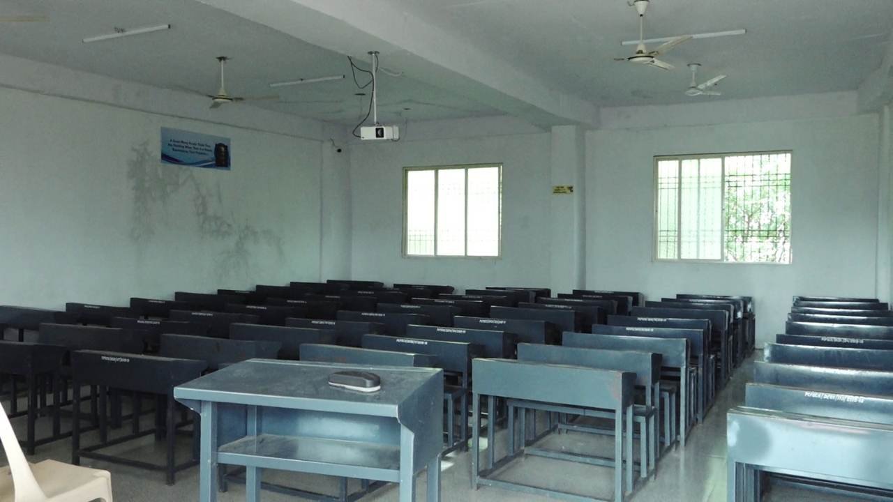 Classroom with rows of student desks and a teaching area