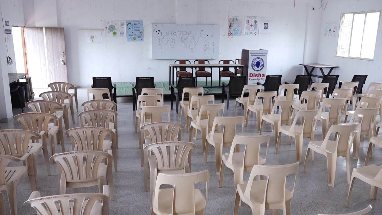 Seminar room arranged with chairs for group sessions